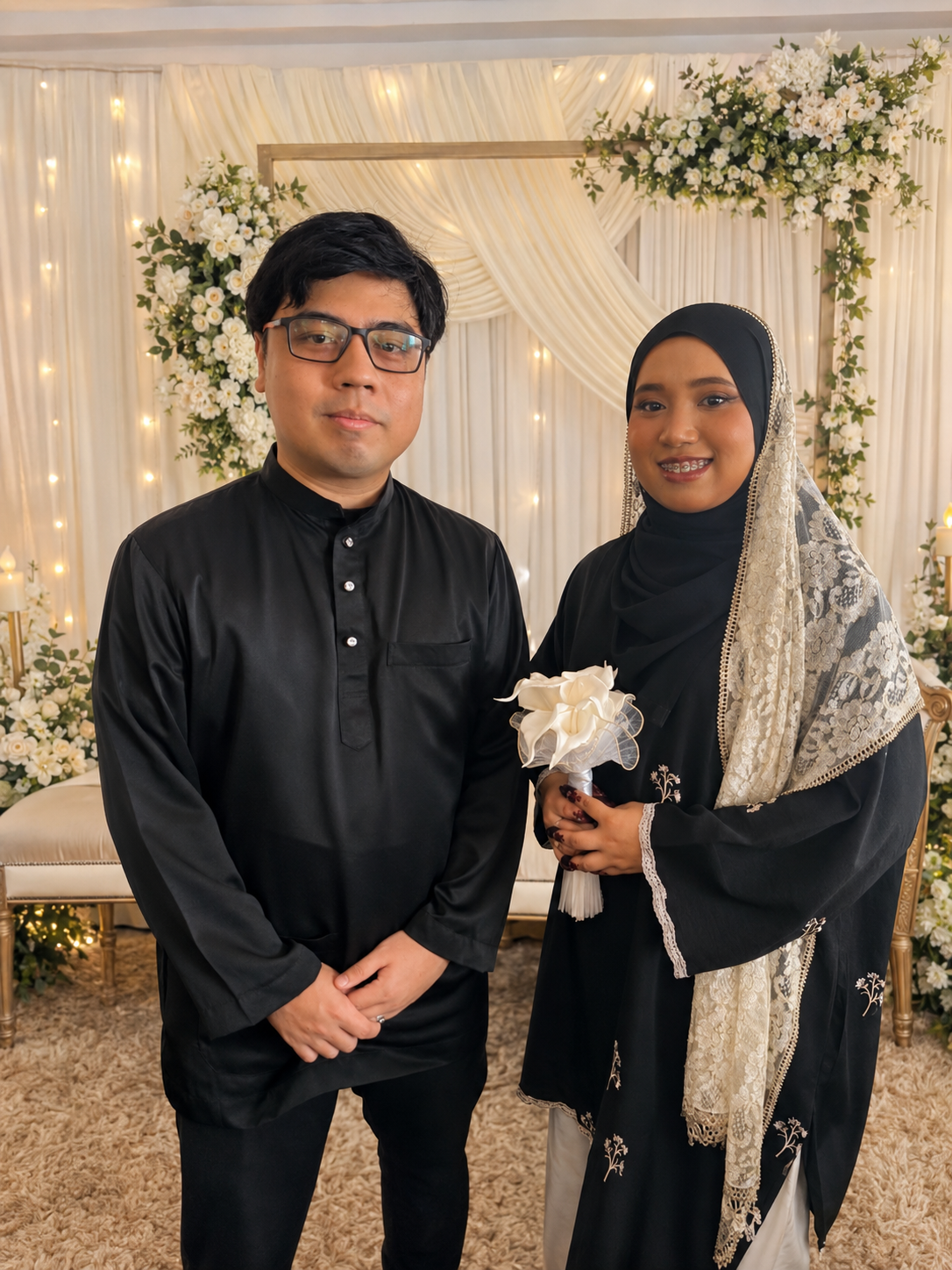 Athirah and Syamir dressed in black