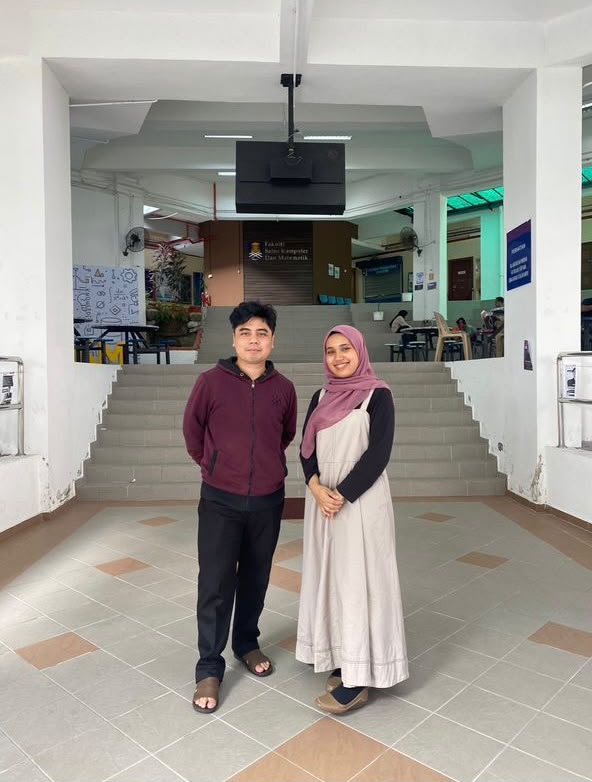 Athirah and Syamir together at UiTM, with Athirah wearing a pink hijab